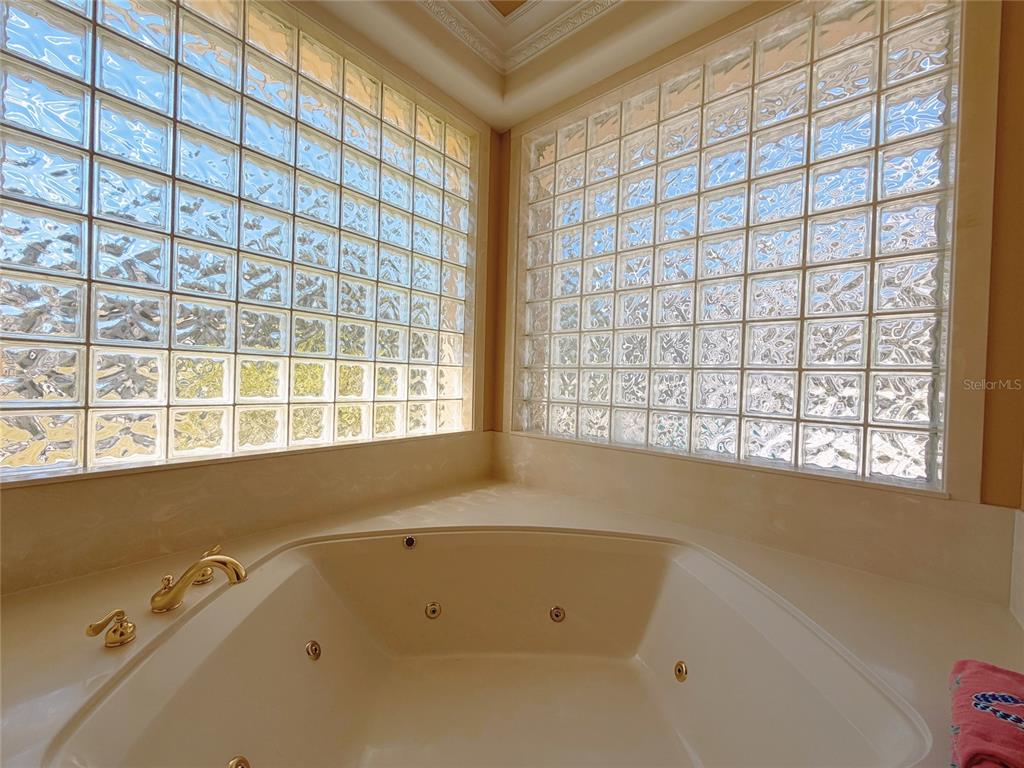4421 Reaves Road Kissimmee, FL 34746 - Photo 26 of 100 a bathroom with a bathtub and window