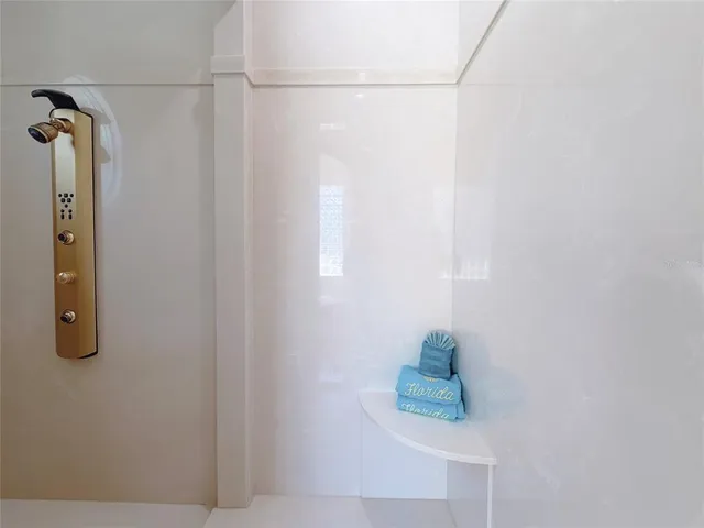 a bathroom with a sink vanity mirror and toilet