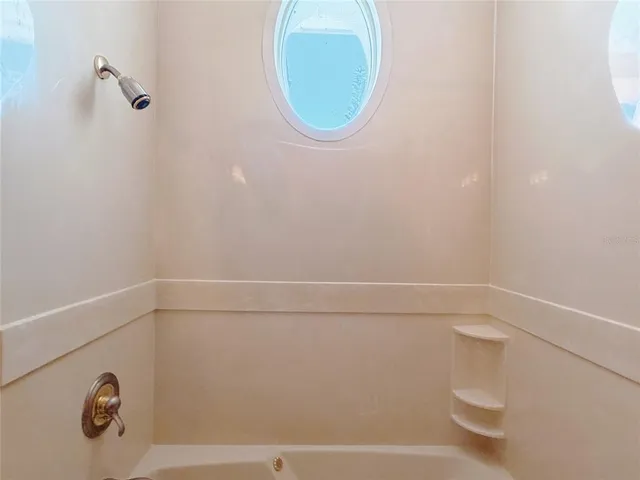 a view of a hallway with wooden shelves