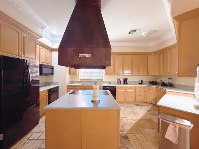 a view of a patio with table and chairs potted plants with wooden floor