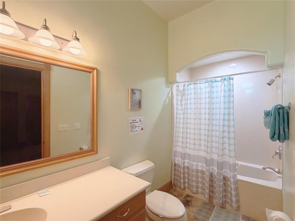 4421 Reaves Road Kissimmee, FL 34746 - Photo 53 of 100 a bathroom with a sink toilet and shower
