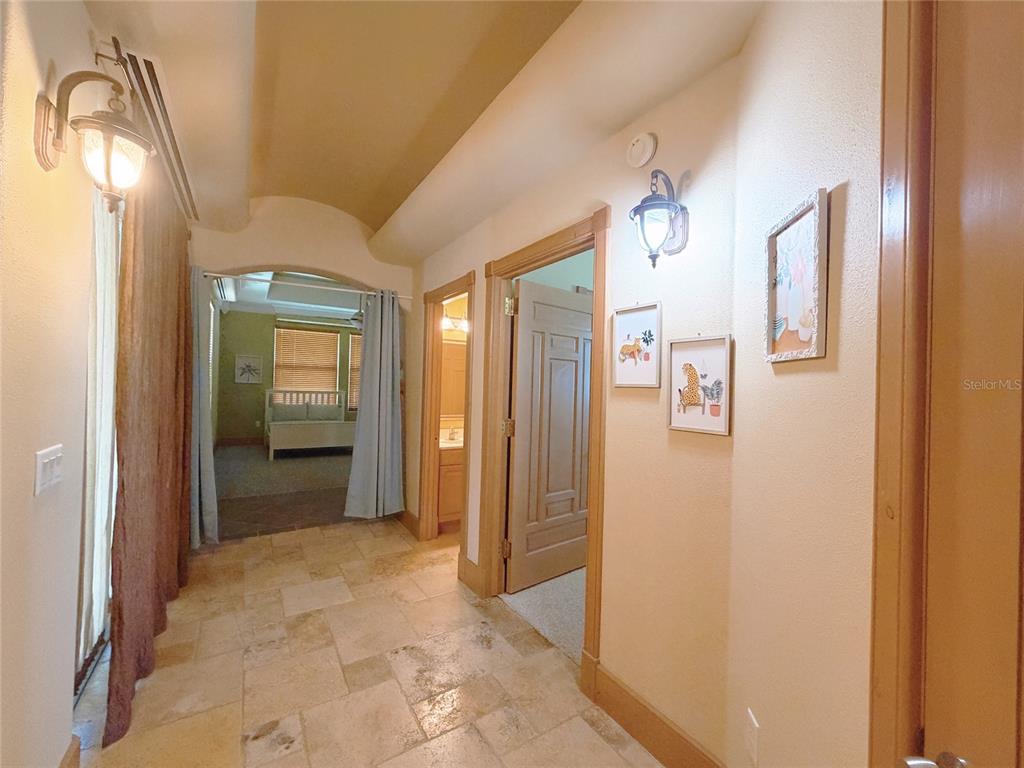 4421 Reaves Road Kissimmee, FL 34746 - Photo 64 of 100 a view of a hallway with wooden shelves