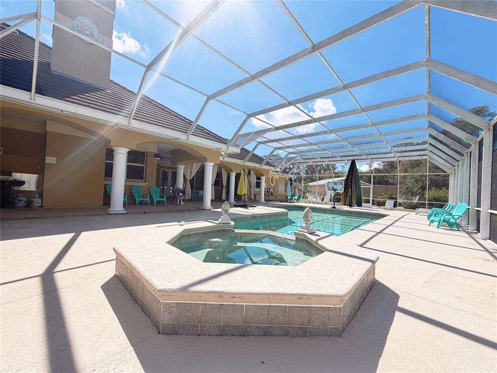 4421 Reaves Road Kissimmee, FL 34746 - Photo 79 of 100 a view of house with swimming pool outdoor seating