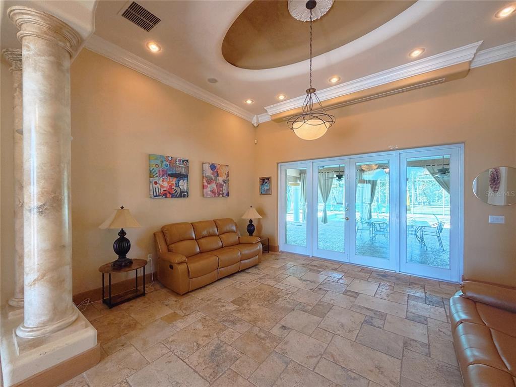 4421 Reaves Road Kissimmee, FL 34746 - Photo 8 of 100 a living room with furniture a ceiling fan and a rug