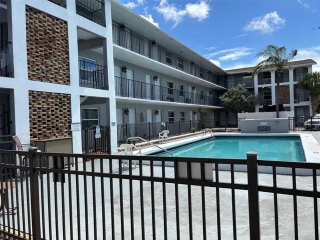 a view of a swimming pool with a patio