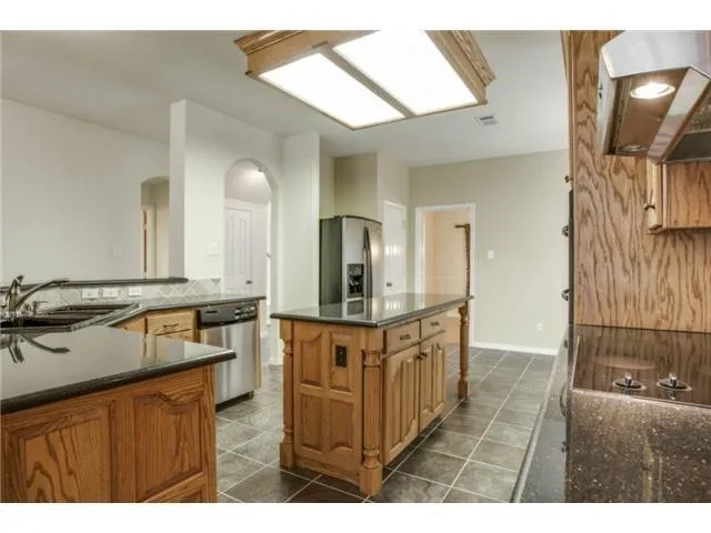 a bathroom with a sink a mirror and a shower