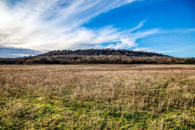 a view of an ocean and mountain