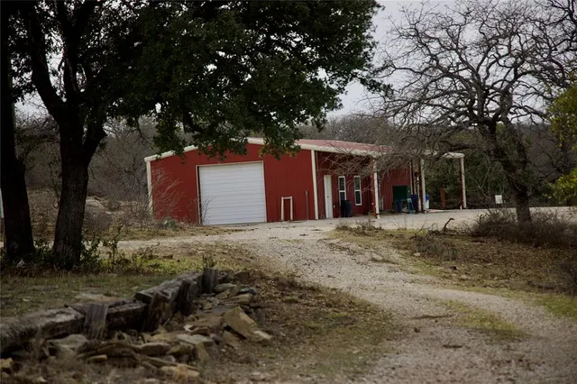a view of a swimming pool with a yard