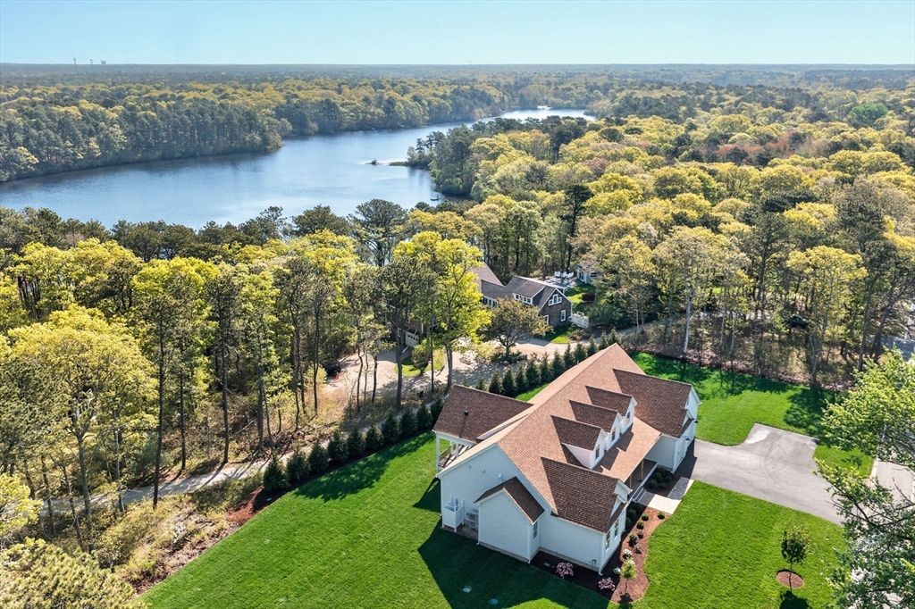 132 Great Western Road Harwich, MA 02645 - Photo 1 of 42 a view of a lake with a mountain