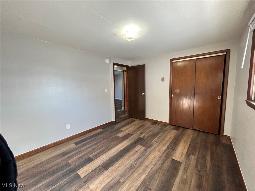 98 View Street, Unit 2 Weirton, WV 26062 - Photo 6 of 10 Unfurnished bedroom featuring dark wood-type flooring and a closet