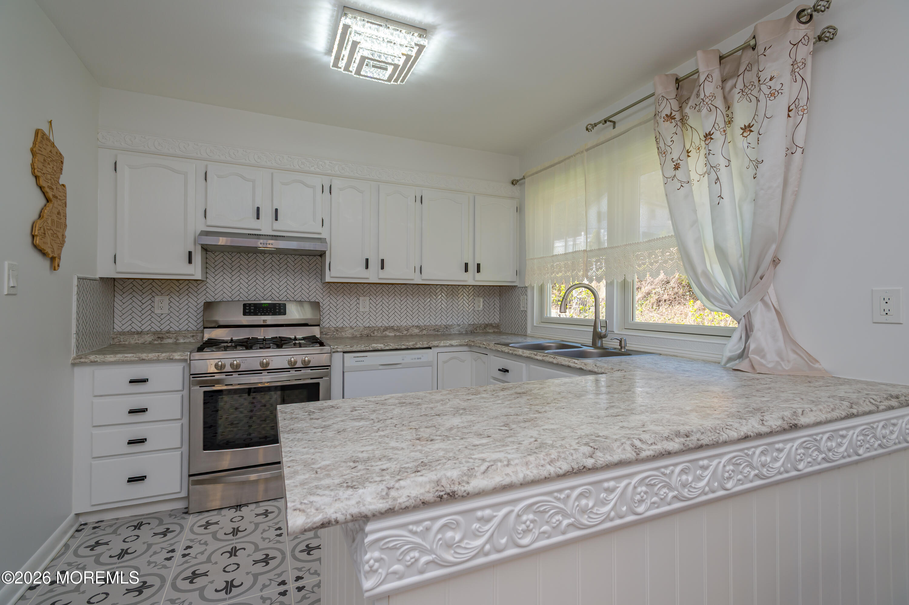 111 Valley Avenue Highlands, NJ 07732 - Photo 11 of 56 a kitchen with granite countertop a stove a sink and a granite counter tops