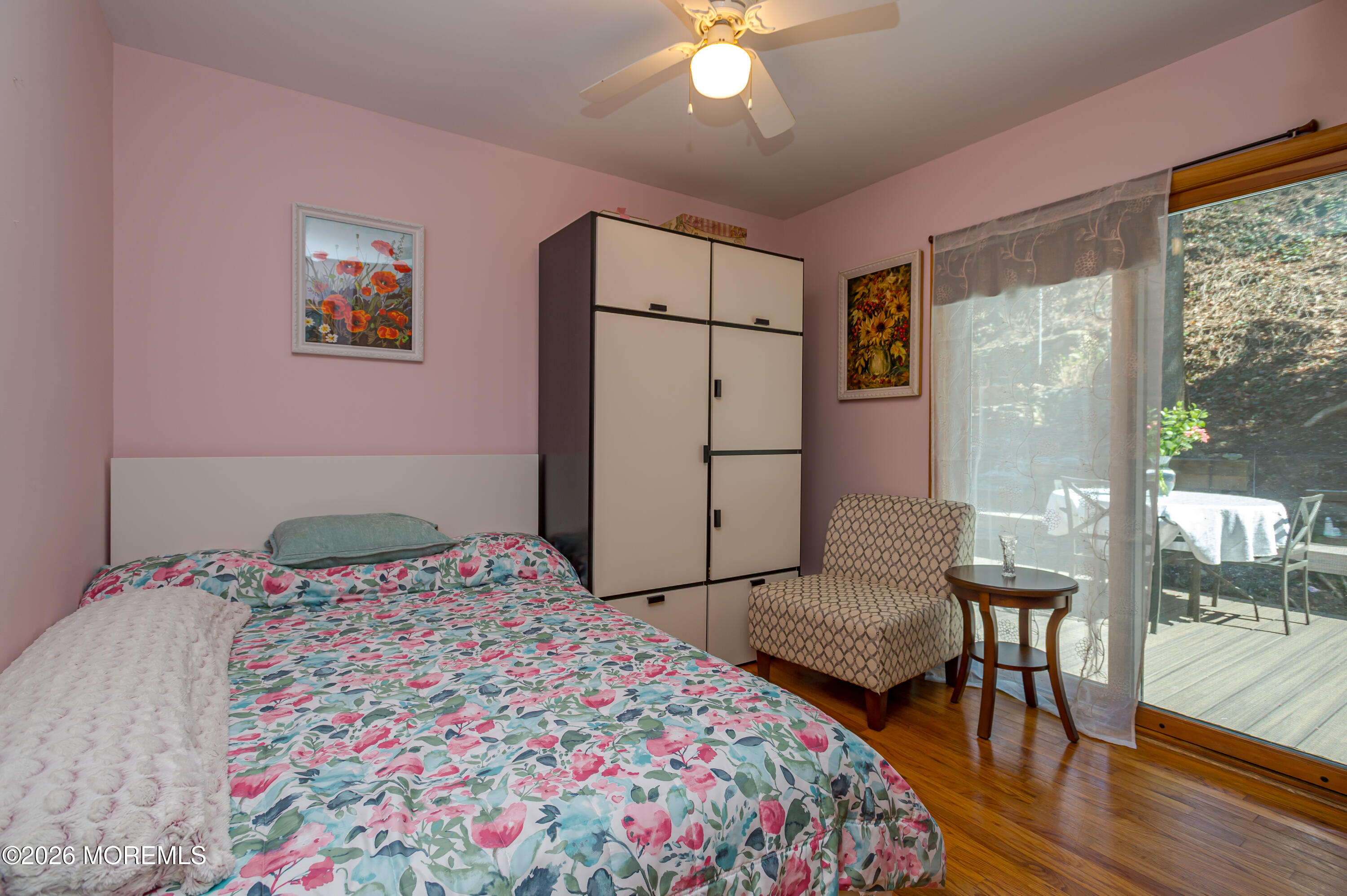 111 Valley Avenue Highlands, NJ 07732 - Photo 19 of 56 a bedroom with a bed and a table in it