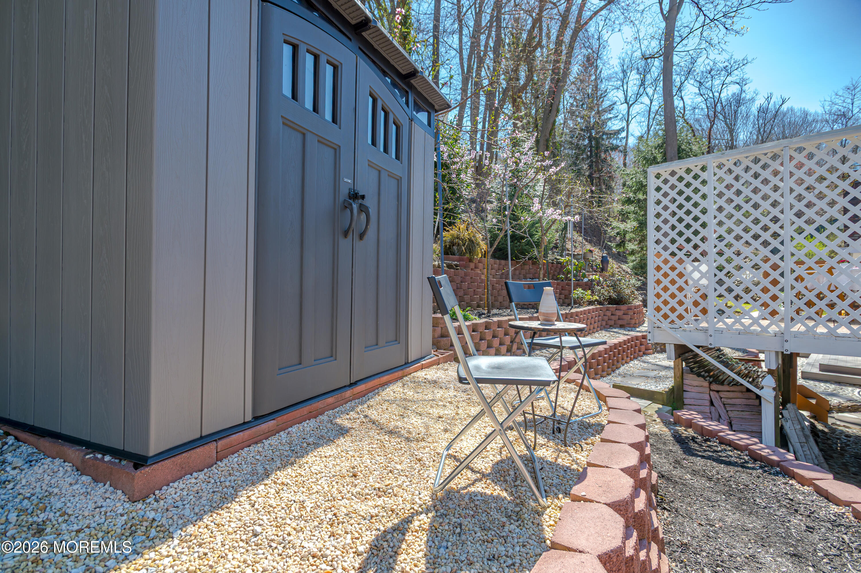 111 Valley Avenue Highlands, NJ 07732 - Photo 34 of 56 a view of a patio with table and chairs with wooden fence