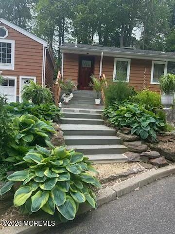 111 Valley Avenue Highlands, NJ 07732 - Photo 43 of 56 a front view of a house with a garden