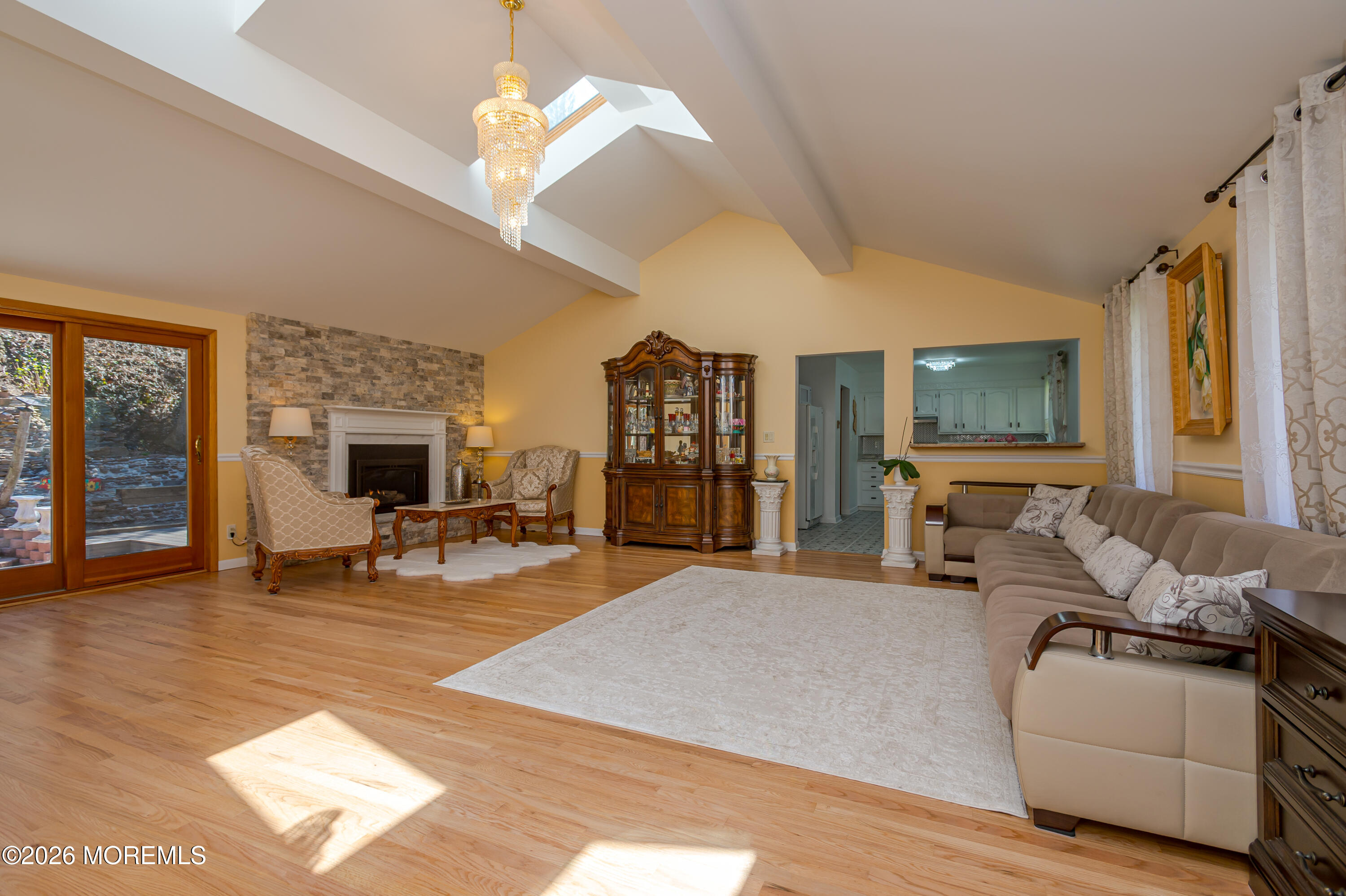 111 Valley Avenue Highlands, NJ 07732 - Photo 5 of 56 a living room with furniture a chandelier and a flat screen tv
