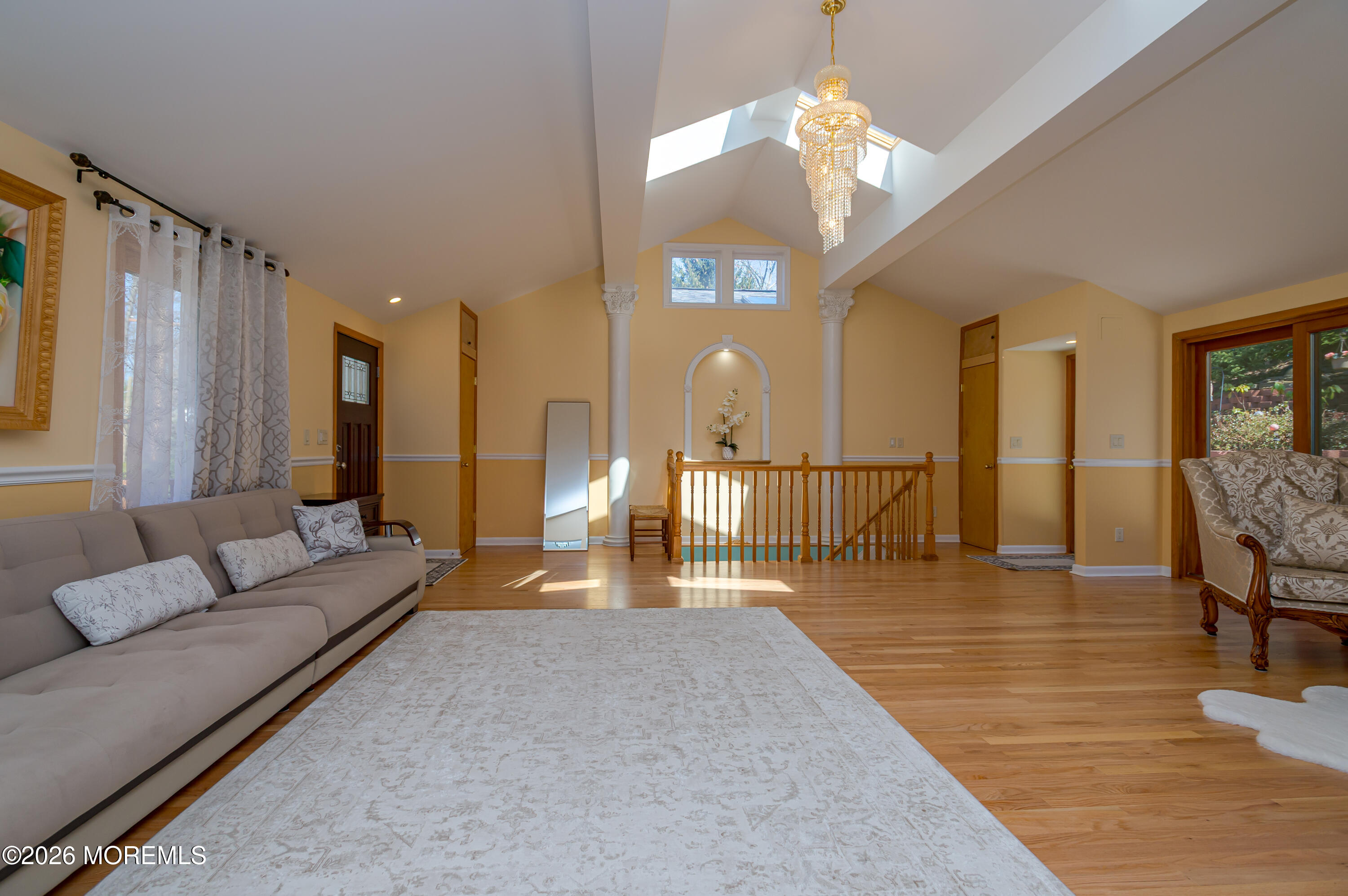 111 Valley Avenue Highlands, NJ 07732 - Photo 8 of 56 a living room with furniture a lamp and a chandelier