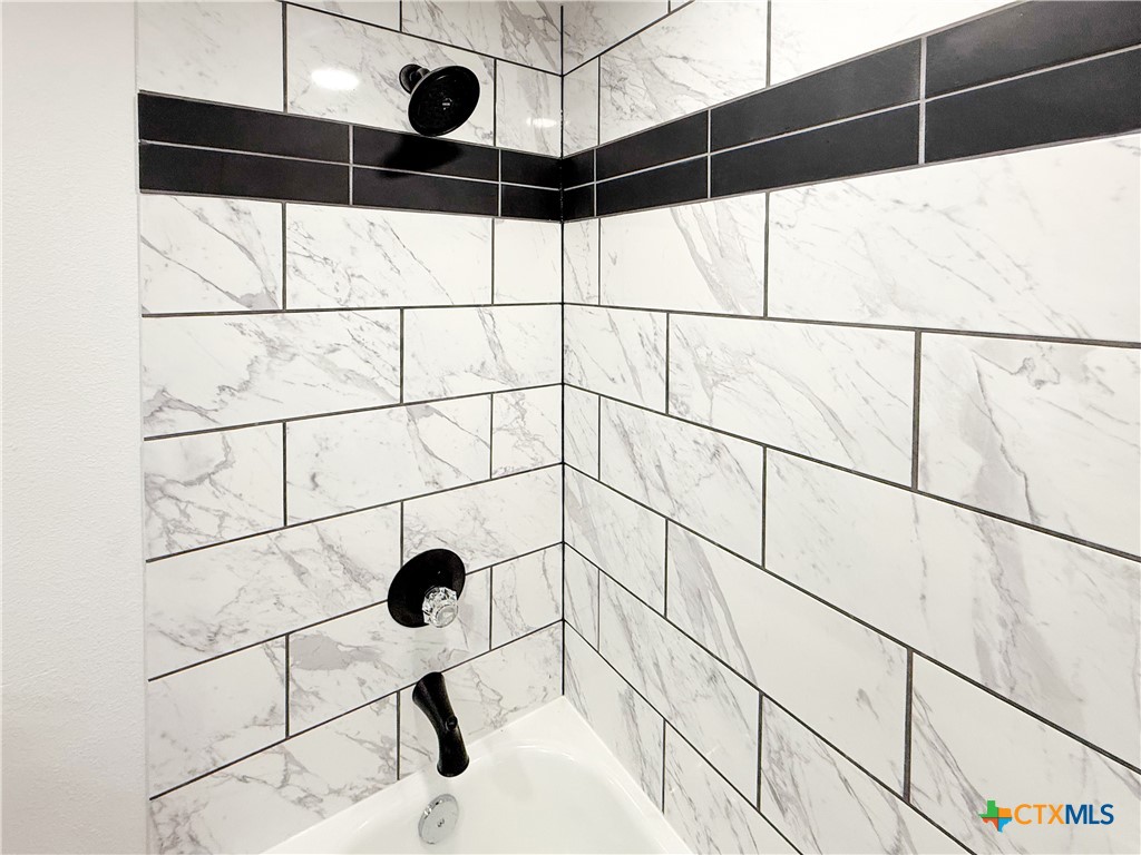 215 East Valley Road Harker Heights, TX 76548 - Photo 12 of 16 a bathroom with a shower and a shower