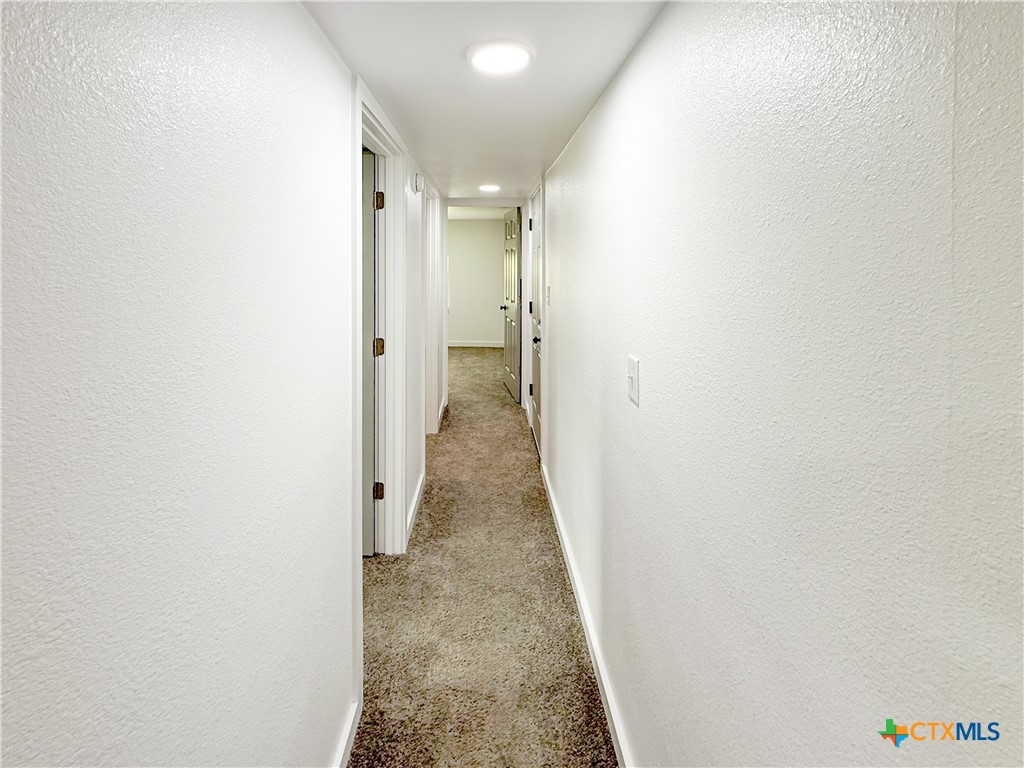 215 East Valley Road Harker Heights, TX 76548 - Photo 8 of 16 a view of a hallway with a white walls