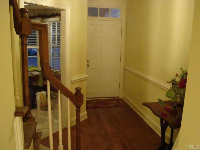 8303 Wycombe Lane Raleigh, NC 27615 - Photo 6 of 10 2-story foyer, beautiful staircase, hardwood floors, and heavy trim set-off this entry Other