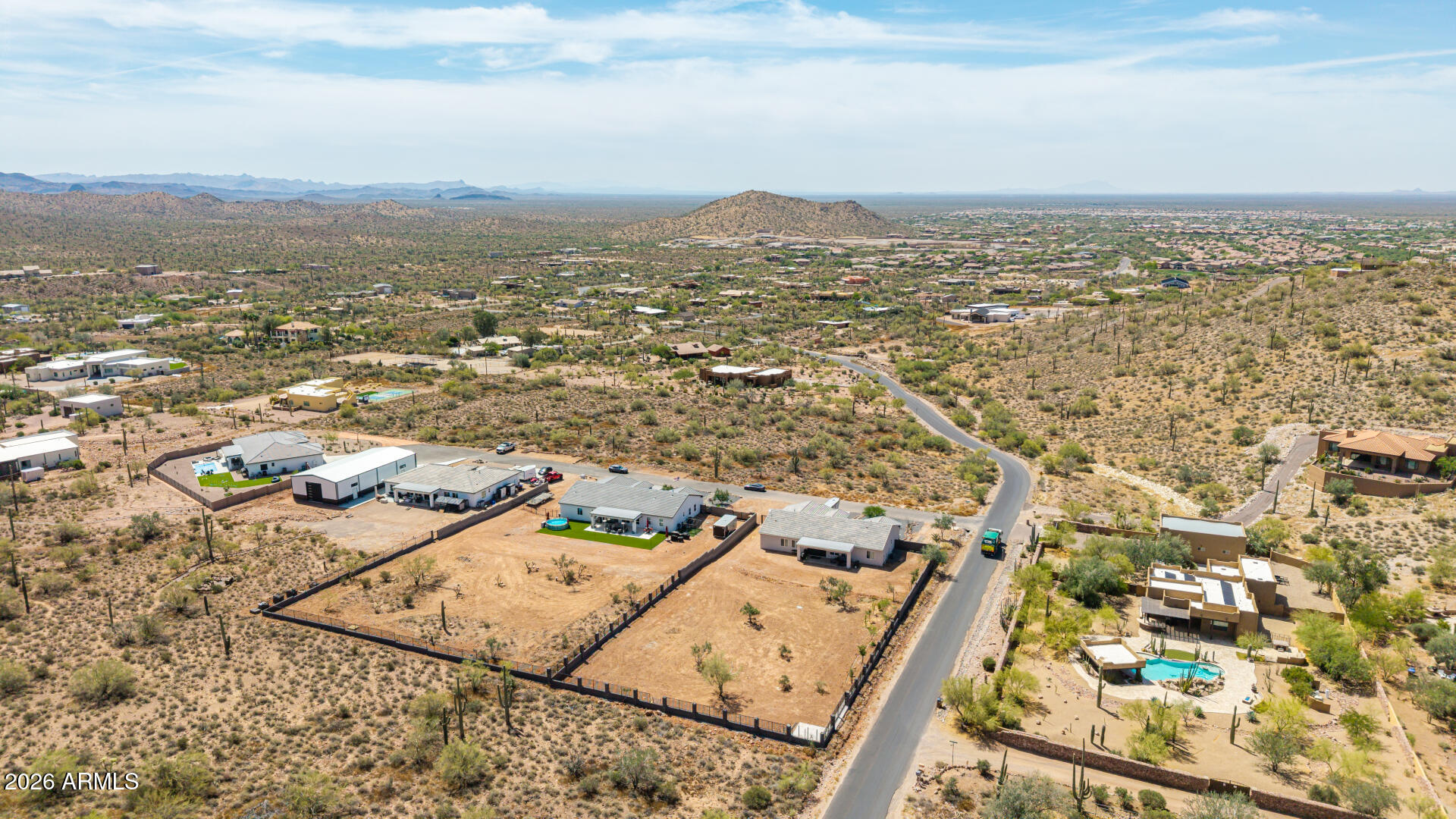 10464 East Magnolia Road Gold Canyon, AZ 85118 - Photo 76 of 77 an aerial view of residential houses with outdoor space