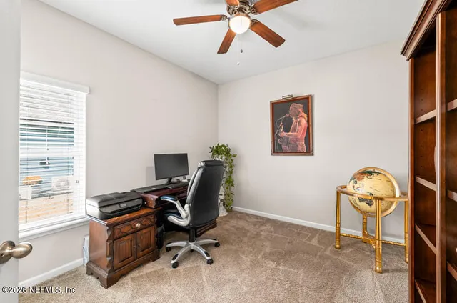 a view of workspace with wooden floor windows