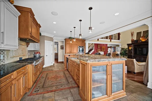 a view of a livingroom with dining room and stairs