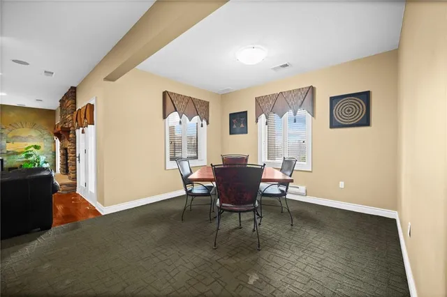 a bedroom with a bed dresser and flat screen tv