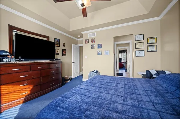 a room with a bed and a flat screen tv