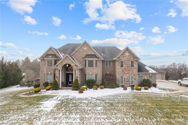a front view of a house with a yard