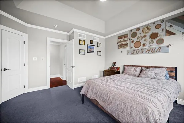 a bedroom with a bed and a walk in closet