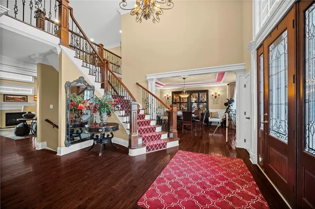 a living room with fireplace furniture and a flat screen tv