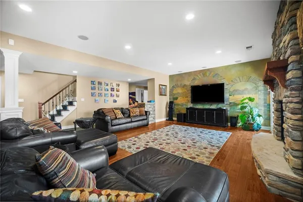 a living room with furniture and a flat screen tv