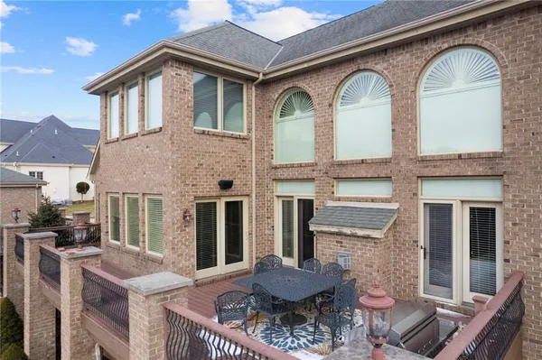 a front view of house with yard outdoor seating and barbeque oven