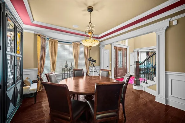 a dining room with a large window and table
