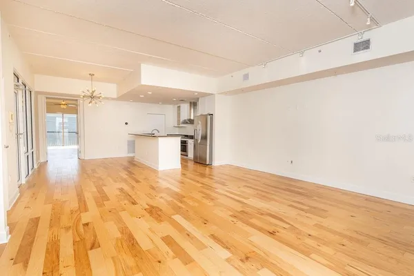 a kitchen with stainless steel appliances granite countertop a sink and a stove