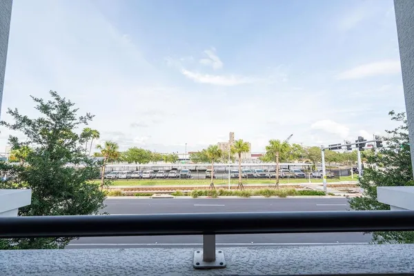 a view of a patio with a table and chairs