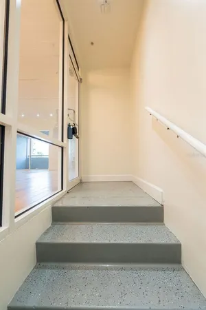 a view of a hallway with windows