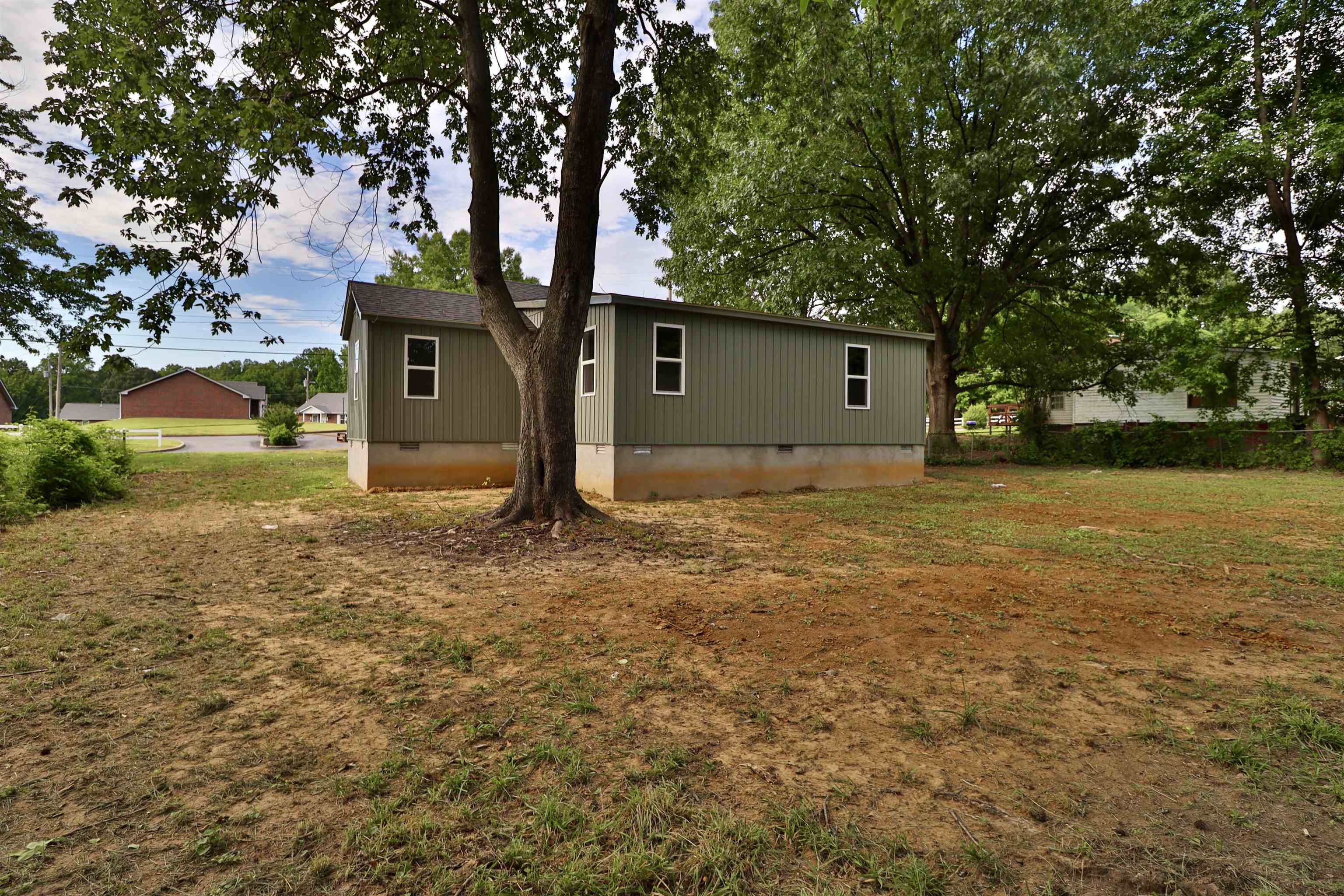 224 Kellar Avenue Ripley, TN 38063 - Photo 33 of 35 a house with trees in front of it