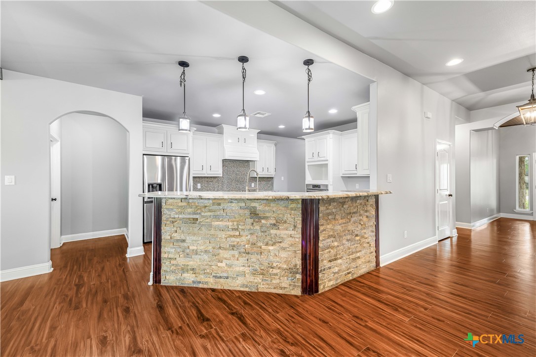 204 James Street Inez, TX 77968 - Photo 8 of 35 a view of kitchen and kitchen with wooden floor