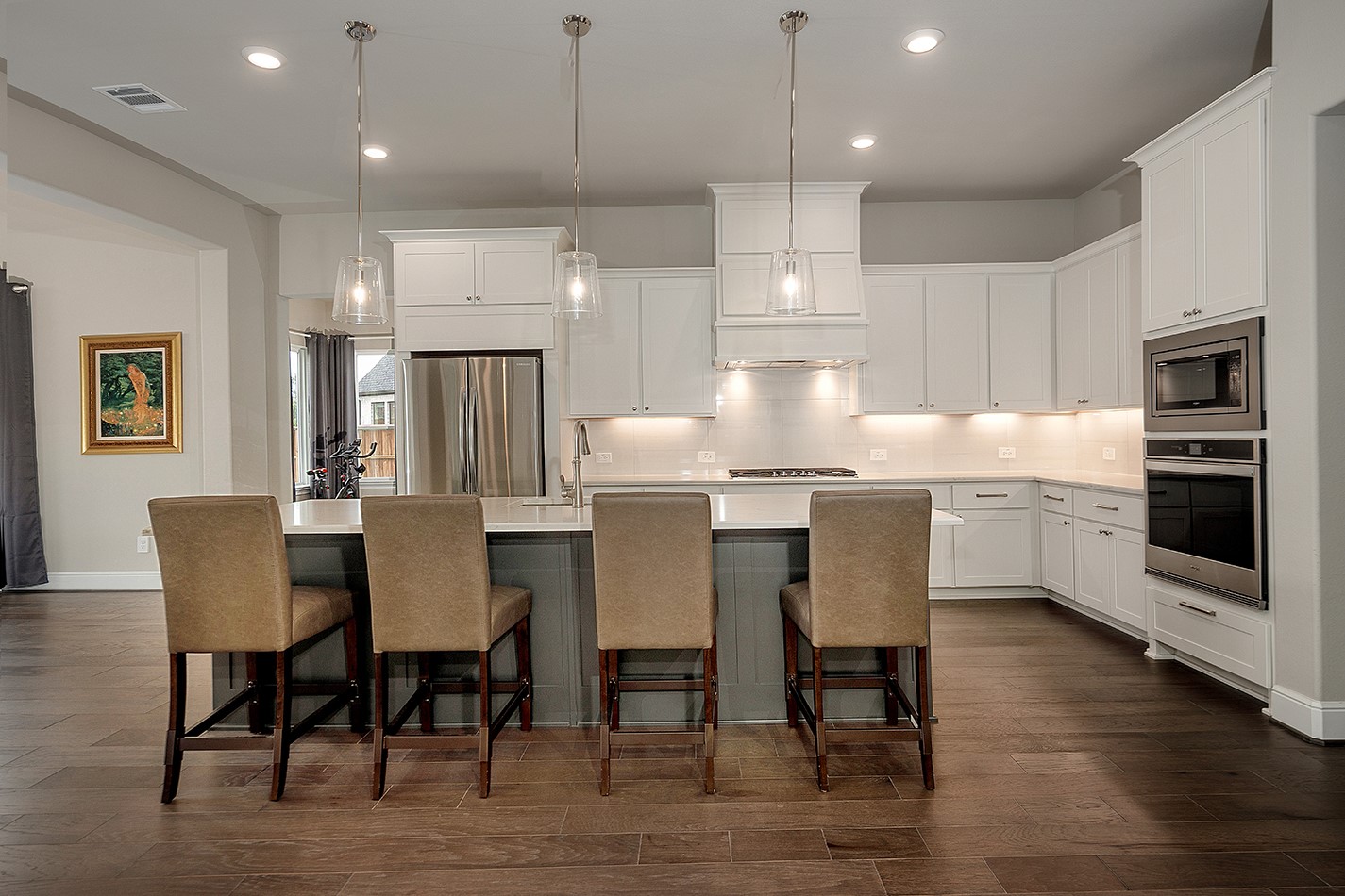 5361 Cherry Spring Drive Spring, TX 77386 - Photo 11 of 35 a kitchen with kitchen island a dining table chairs and white cabinets