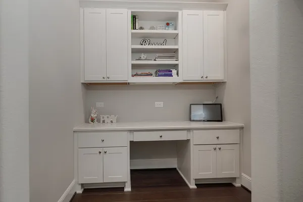 a view of cabinets with wooden floor