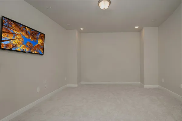 a bedroom with a bed and flat screen tv