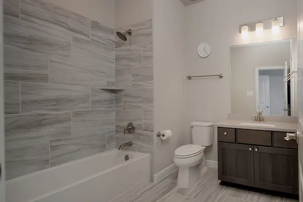 a bedroom with a large bed and a dresser