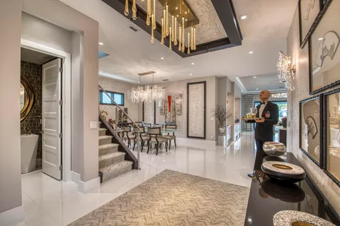 a bathroom with a granite countertop shower a sink and a mirror