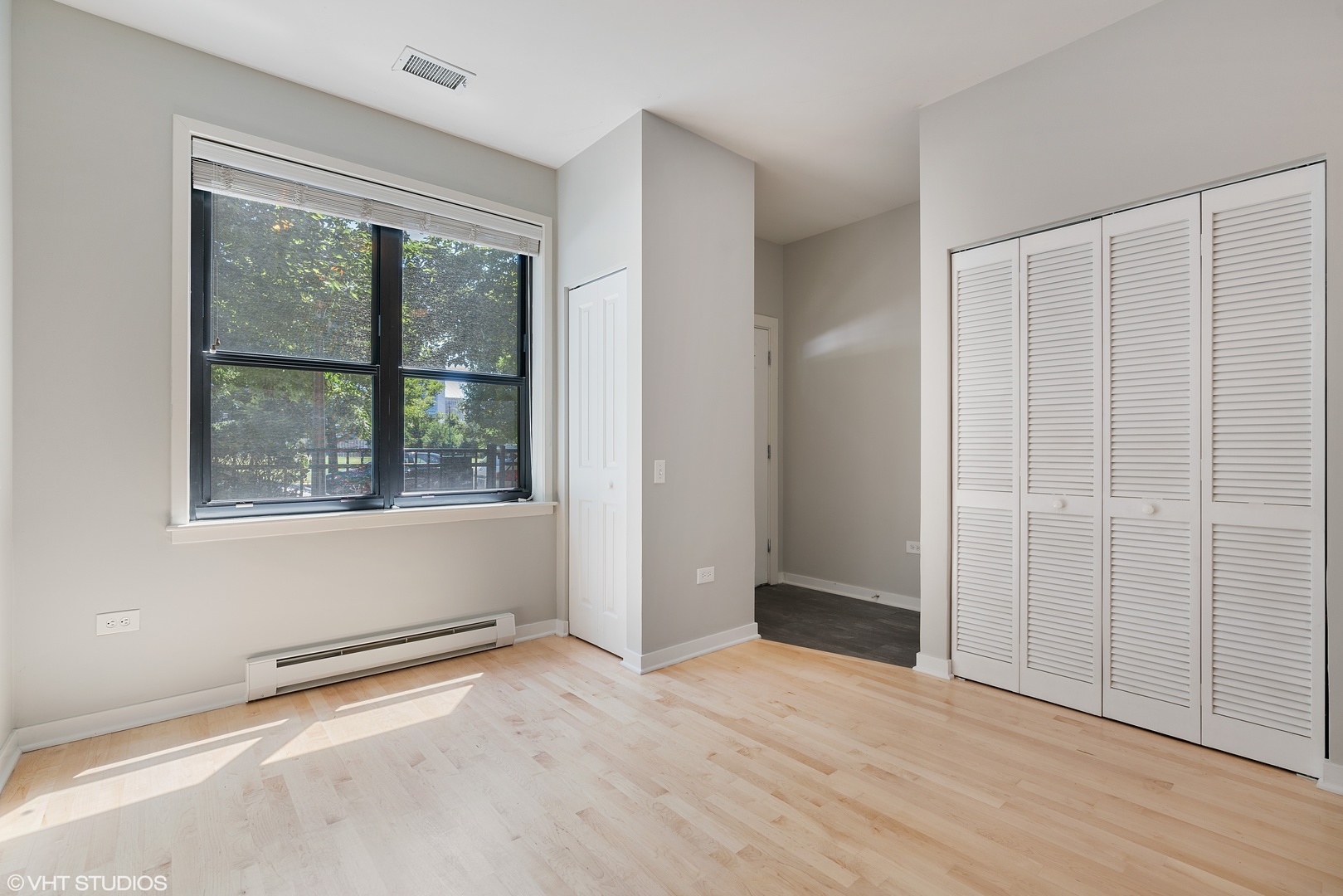 434 West Elm Street Chicago, IL 60610 - Photo 12 of 18 an empty room with wooden floor and windows