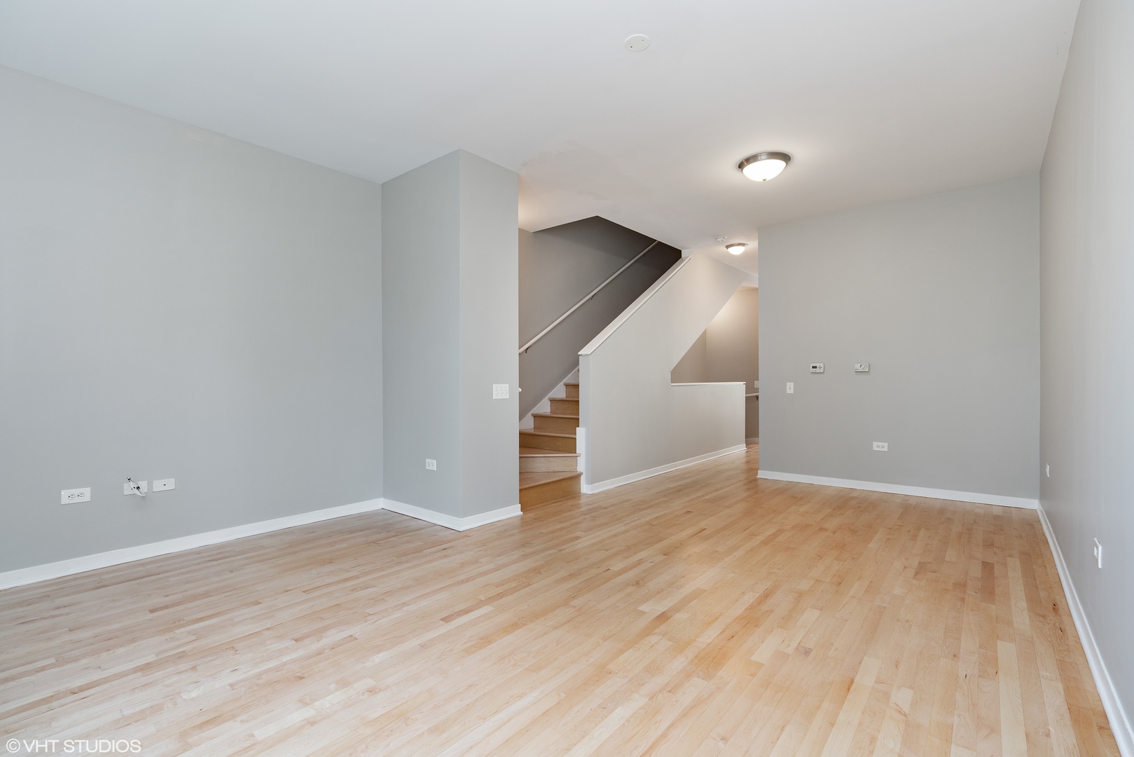 434 West Elm Street Chicago, IL 60610 - Photo 5 of 18 a view of an empty room with wooden floor