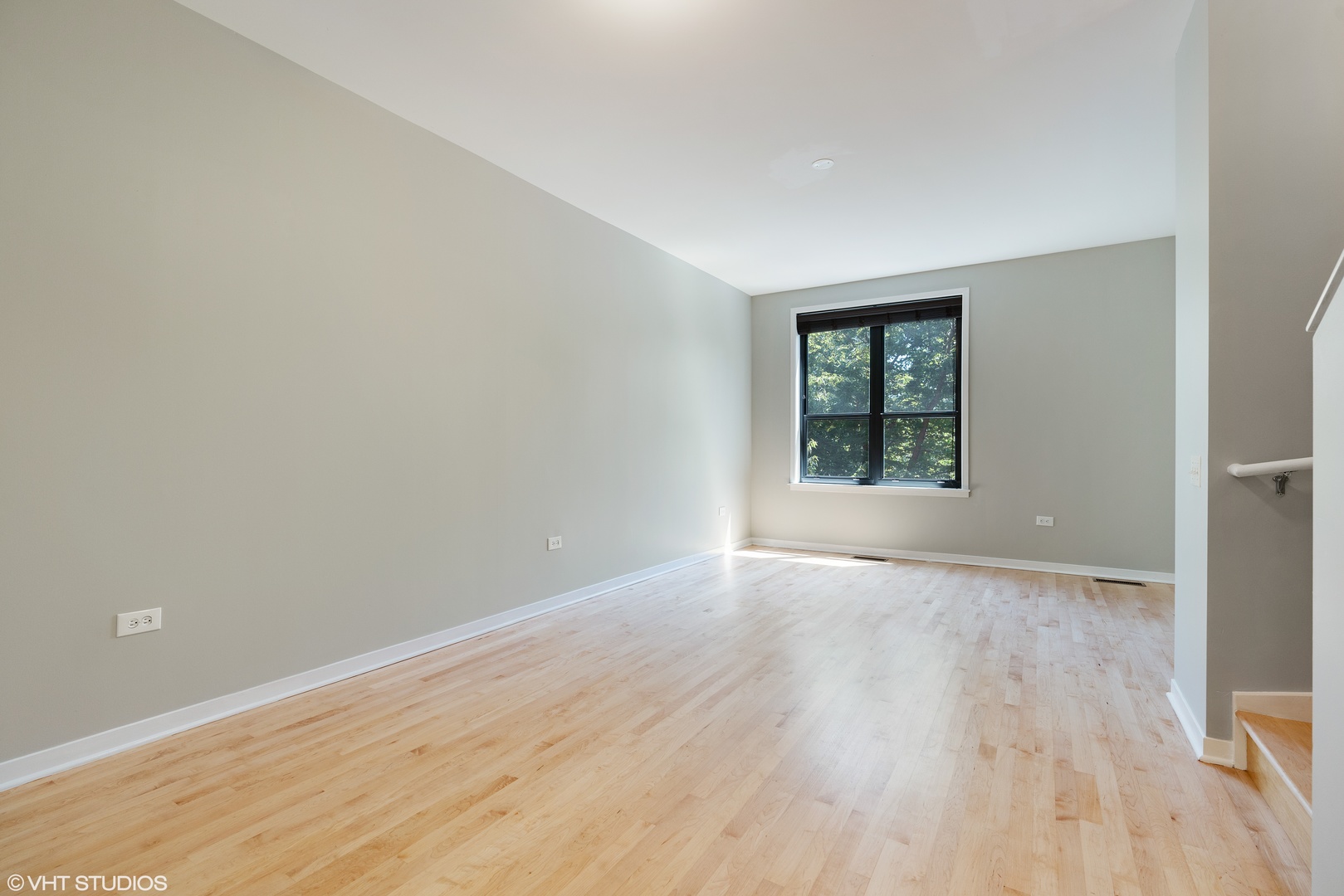 434 West Elm Street Chicago, IL 60610 - Photo 6 of 18 a view of an empty room with wooden floor and a window
