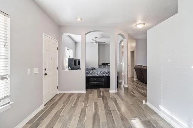 a view of a hallway view with staircase