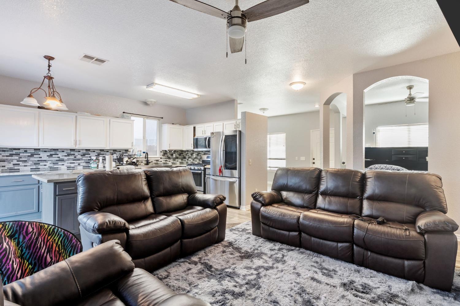 701 Palmer Place Atwater, CA 95301 - Photo 12 of 31 a living room with furniture and a view of kitchen