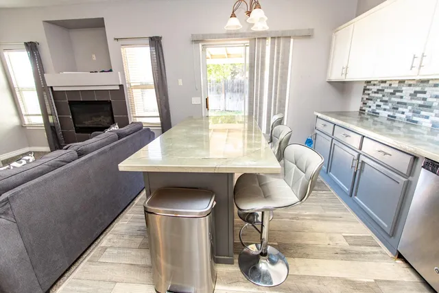 a bedroom with a bed and a white comforter